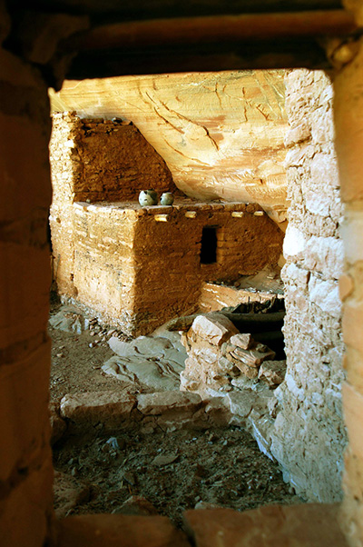 Ancient pots sitting on a ruin wall